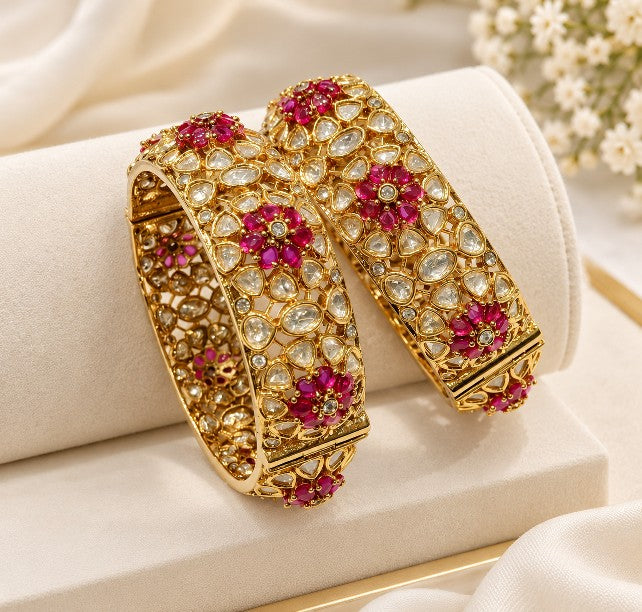  Traditional North Indian bridal bangles with intricate gold-tone detailing and red stone embellishments, ethnic wedding jewellery for women