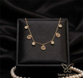 gold gg charm tanmaniya necklace anti tarnish
waterproof gg necklace stainless steel jewellery
trendy gg charm gold necklace daily wear
anti tarnish gg letter necklace lightweight
stainless steel gold gg necklace with stones