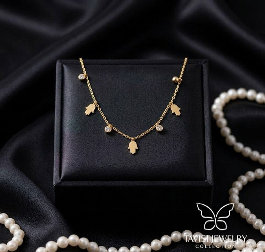 gold hamsa charm tanmaniya necklace anti tarnish
waterproof hamsa necklace stainless steel jewellery
gold anti tarnish necklace with hamsa hand design
daily wear hamsa charm necklace lightweight
stainless steel gold hamsa necklace with stones