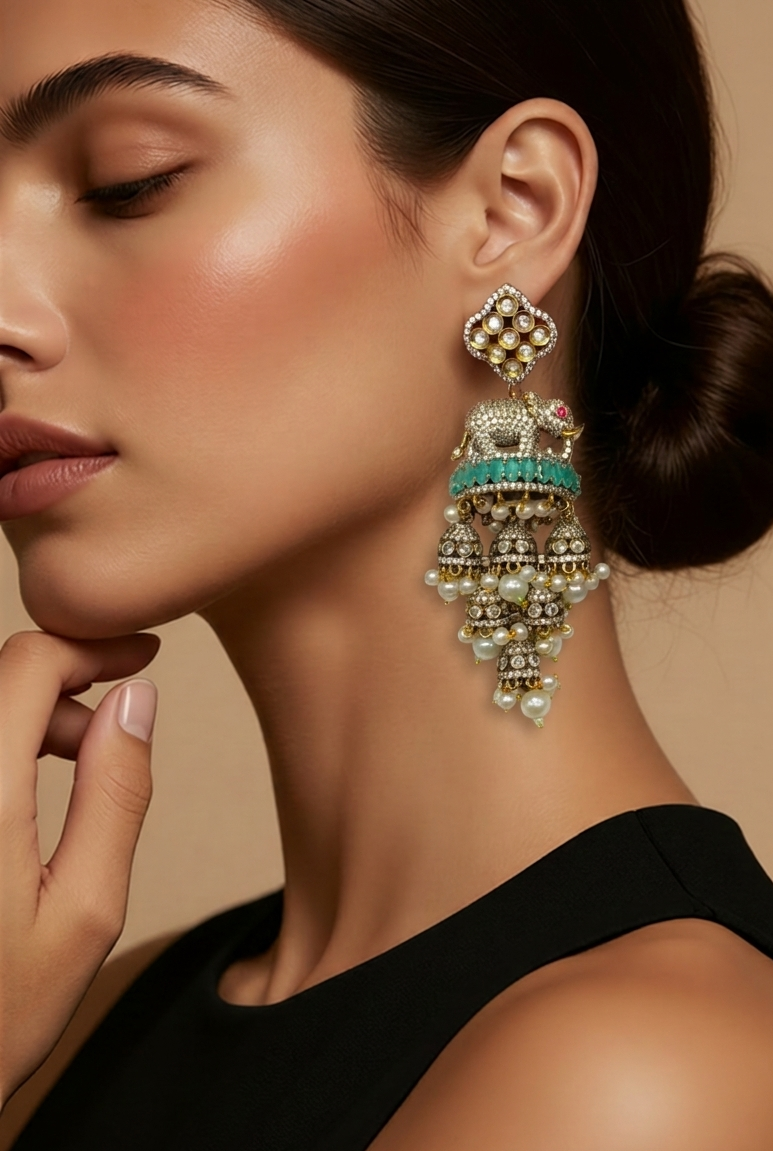 Detailed view of Tavisi Elephant Motif Polki Kundan AD Long Jhumki Earrings showcasing intricate craftsmanship, Mint Green stones and elegant pearl accents.