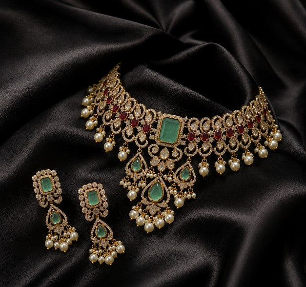 Aaradhya Kundan choker necklace and earrings set with green stones and pearl drops