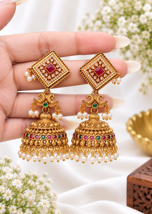 Alloy Kundan-style jhumka earrings with ruby red green multicolor stones and white pearl drops
