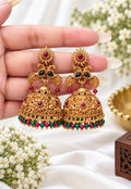 Alloy Kundan jhumka earrings with ruby red and emerald green stones and red green beaded drops