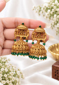Alloy Lakshmi Devi jhumka earrings with green stone and green bead drops