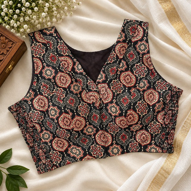 Black and rust Ajrakh printed cotton sleeveless blouse with traditional ethnic geometric floral pattern