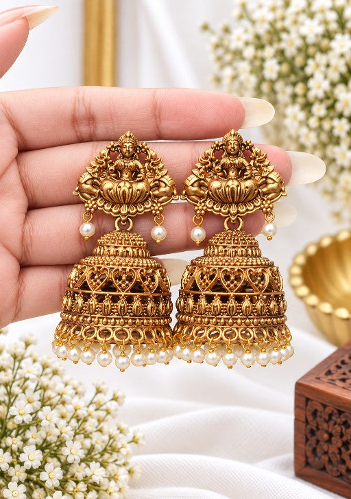 Divya Lakshmi gold-tone jhumka earrings with Goddess Lakshmi motif and white pearl drops