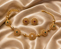 Gold plated green stone choker necklace set with multicolor stone detailing and matching earrings, traditional alloy jewellery for women