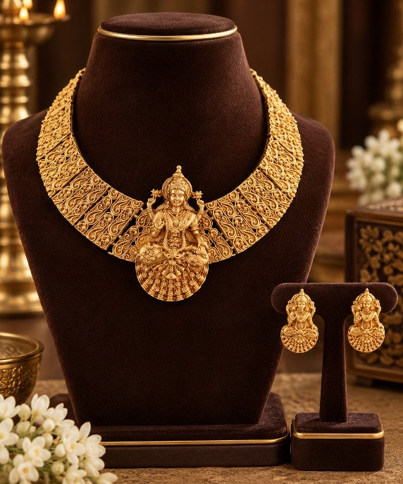 Heavy South Indian gold plated Lakshmi temple necklace with intricate traditional motifs and matching stud earrings