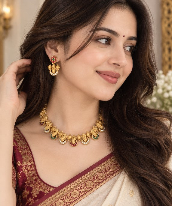 High gold plated Balaji necklace set with Shanku Chakra motifs, traditional South Indian temple jewellery detailing and matching earrings