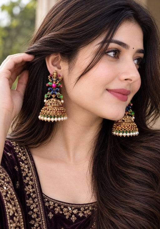 Lakshmi Rangoli Royal Temple Jhumka with colourful Lakshmi motif and pearl drops worn by a woman