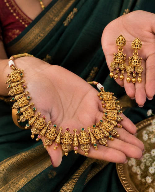Goddess Lakshmi temple necklace with ruby and emerald coloured small stones, South Indian traditional jewellery