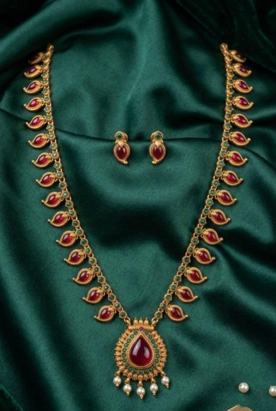 Mango Palakka long haram featuring emerald green stones, ruby stone detailing and traditional gold-tone design, South Indian jewellery for women