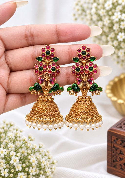 Mayura Royale Peacock Jhumka with ruby red and emerald green stones, gold tone detailing and white pearl drops