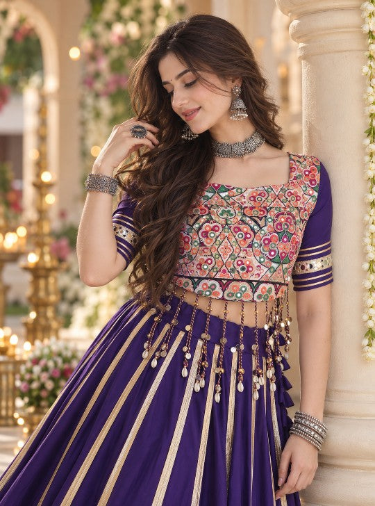 Close-up of royal purple lehenga choli with Kutchi Gamthi embroidery and mirror embellishments