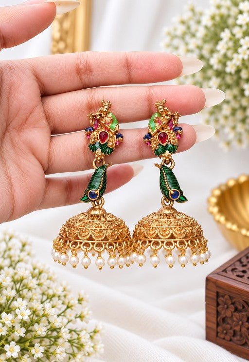 Radha Krishna inspired peacock jhumka with ruby red, emerald green and blue stones and white pearl drops
