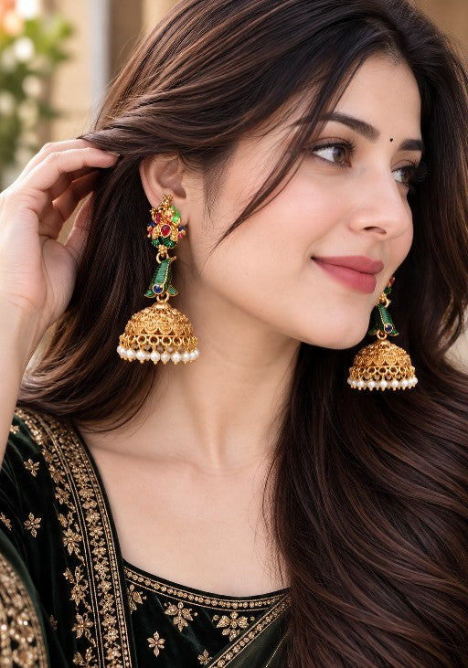 Radha Krishna inspired peacock jhumka with multicolour stones and white pearl fringe worn by a woman