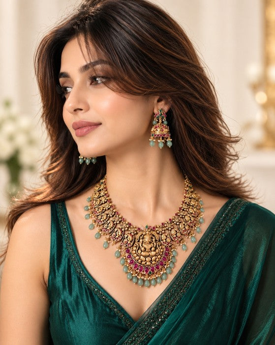 South Indian traditional jewellery collection featuring an elegant green stone choker necklace and matching jhumka earrings for bridal, wedding and festive wear
