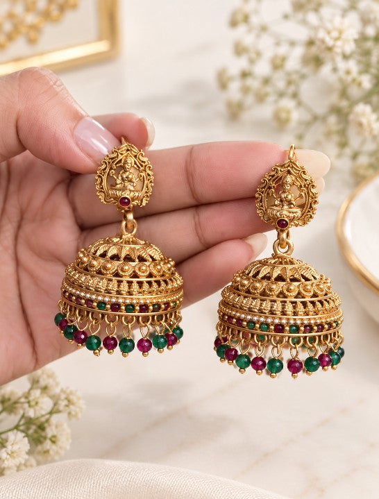 South Indian gold plated Lakshmi jhumka earrings with green and ruby red multicolor beads and traditional temple jewellery design