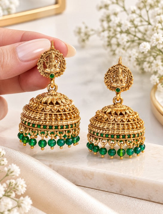 South Indian Lakshmi jhumka earrings with ruby red bead drops, high gold plated finish and traditional temple jewellery design