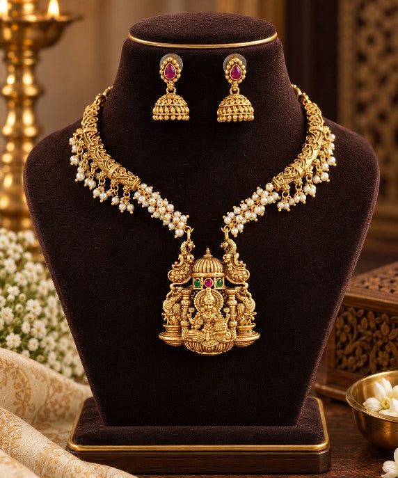 South Indian Lakshmi temple jewellery necklace set with high gold plating, Goddess Lakshmi pendant, pearl detailing and matching Jhumka earrings