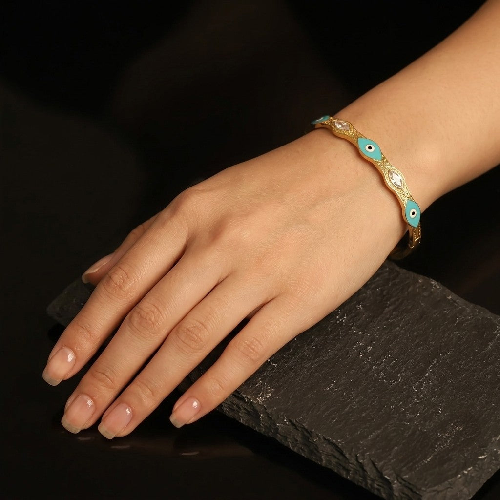 Tavisi Elara Charm Bracelet in 22K gold plated stainless steel with turquoise charm and premium stone accents, anti tarnish waterproof bracelet.
