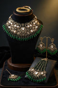 Turkish statement bridal choker necklace set featuring CZ, AD stones, baroque pearls, emerald green beads, matching earrings, maang tikka and chutti in antique finish.