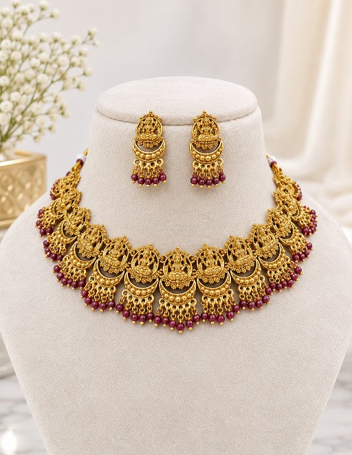 Aadhira Lakshmi traditional bridal necklace set with matching earrings and ruby bead detailing