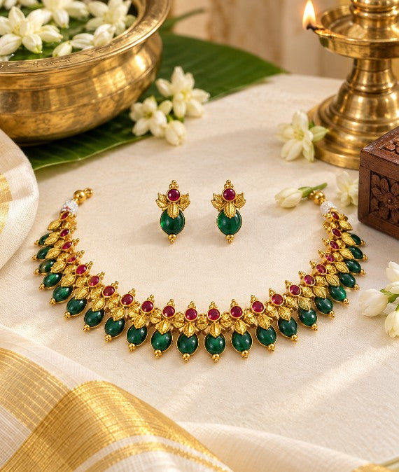 Emerald green and ruby red Palakka necklace in antique gold matte finish