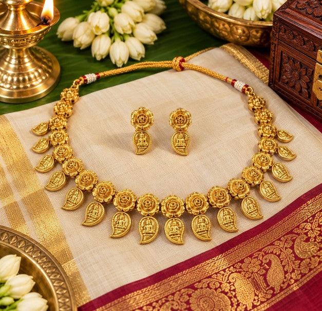 Aaradhya Lakshmi coin necklace set displayed with traditional Indian saree