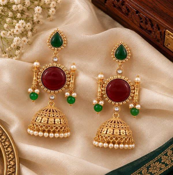 Aarini ruby red and green traditional jhumka earrings with gold-tone finish