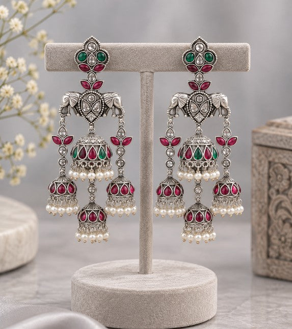 Avyara Premium elephant motif AD jhumka dangler earrings with green and ruby stones