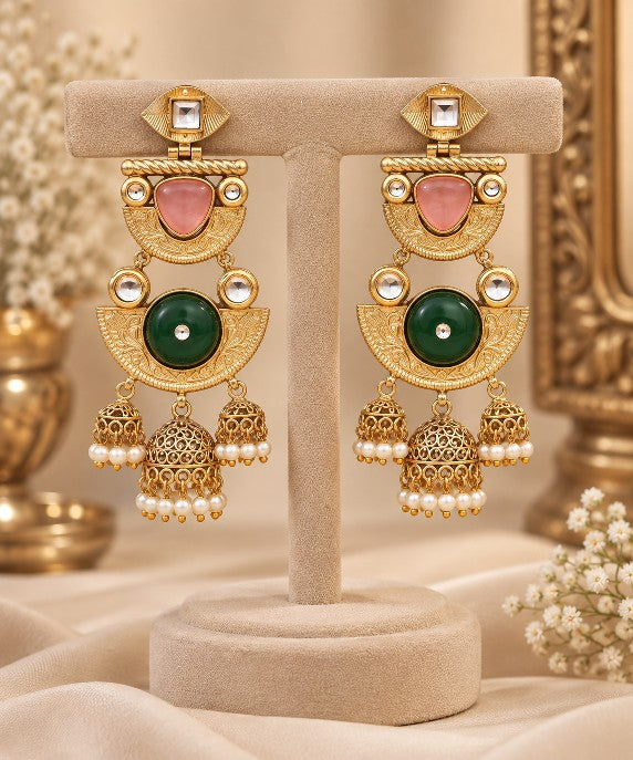 Avyara ruby green traditional jhumka earrings with golden finish