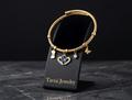 Tavisi Celeste Blue Charm Bracelet featuring a blue crystal centre charm, butterfly charms and anti-tarnish stainless steel construction.