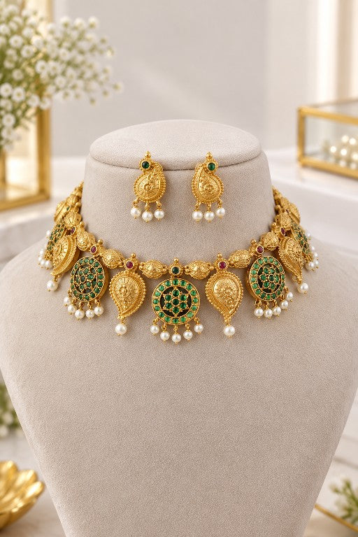 Devika traditional Indian bridal choker necklace set with emerald green stone detailing and pearl drops
