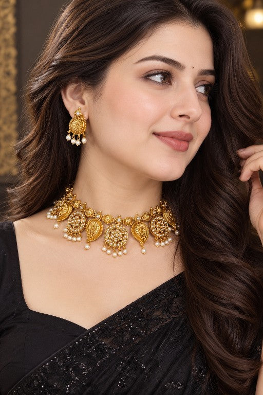 Indian female model wearing Devika heritage temple-inspired choker necklace set with matching earrings