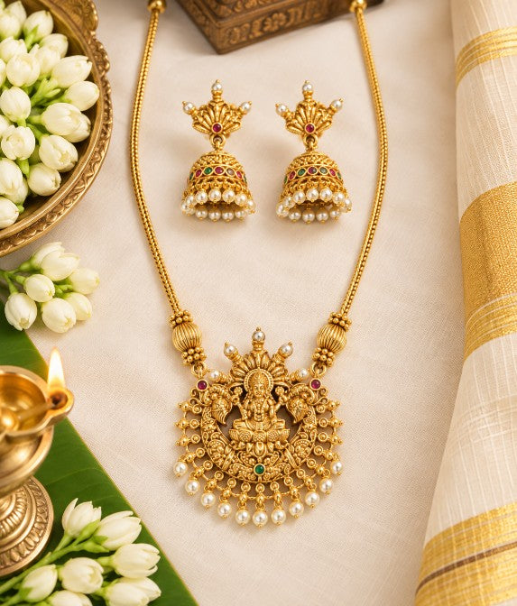 Dhanya Lakshmi pendant necklace with pearl drops and traditional red green stone detailing