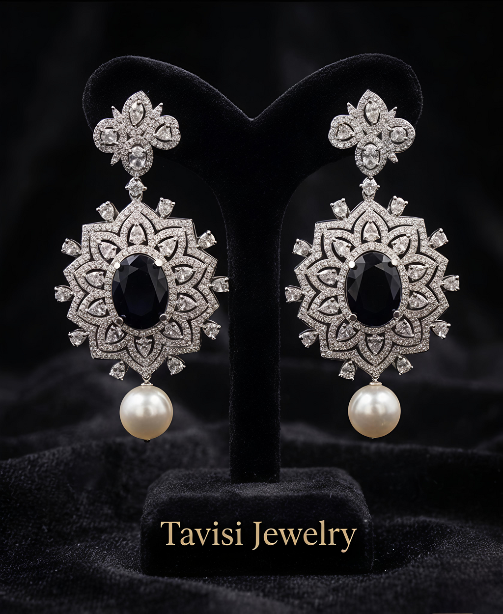 Tavisi Elara Midnight Mandala Drops featuring navy blue centre stones, sparkling AD stones and elegant pearl accents.