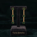 Tavisi emerald line CZ drop earrings with green cubic zirconia stones and 22k gold plated anti tarnish stainless steel finish for women