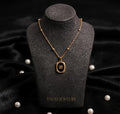 Gold Black Enamel Oval Pendant Necklace worn by model - Tavisi Jewelry Collection
