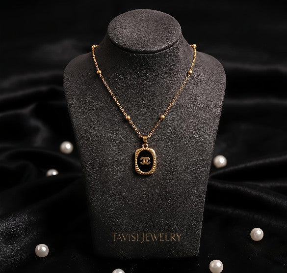 Gold Black Enamel Oval Pendant Necklace worn by model - Tavisi Jewelry Collection