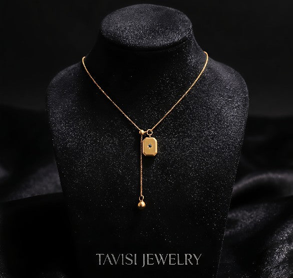 Gold Blue Stone Pendant Necklace worn by model - Tavisi Jewelry Collection