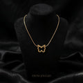 Gold Butterfly Outline Necklace worn by model - Tavisi Jewelry Collection