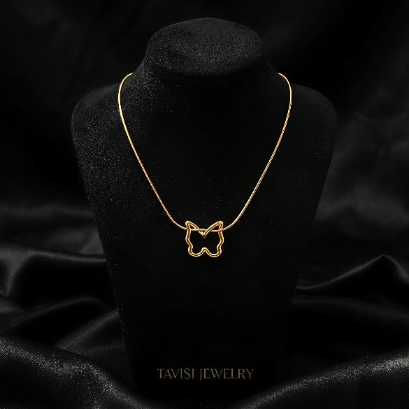 Gold Butterfly Outline Necklace worn by model - Tavisi Jewelry Collection