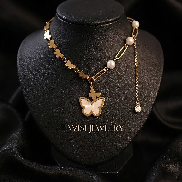 Gold Butterfly Pearl Charm Necklace with Crystal Drop worn by model - Tavisi Jewelry Collection