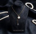 Gold Evil Eye Chain Pendant Necklace with Blue Stone Drop worn by model - Tavisi Jewelry Collection