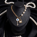 Gold Evil Eye Key Lock Charm Necklace with Pearl CZ Chain worn by model Tavisi Jewelry Collection