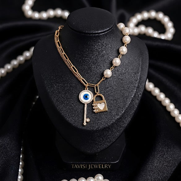 Gold Evil Eye Key Lock Charm Necklace with Pearl CZ Chain worn by model Tavisi Jewelry Collection