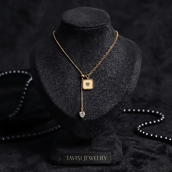 Gold Heart Pendant Necklace with Crystal Drop worn by model - Tavisi Jewelry Collection