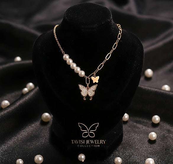 Gold Pearl Butterfly Charm Necklace worn by model - Tavisi Jewelry Collection