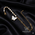 Gold White Butterfly Charm Bracelet with bead chain on white fabric - Tavisi Jewelry Collection